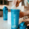 picture of protein being scooped into a protein shaker bottle